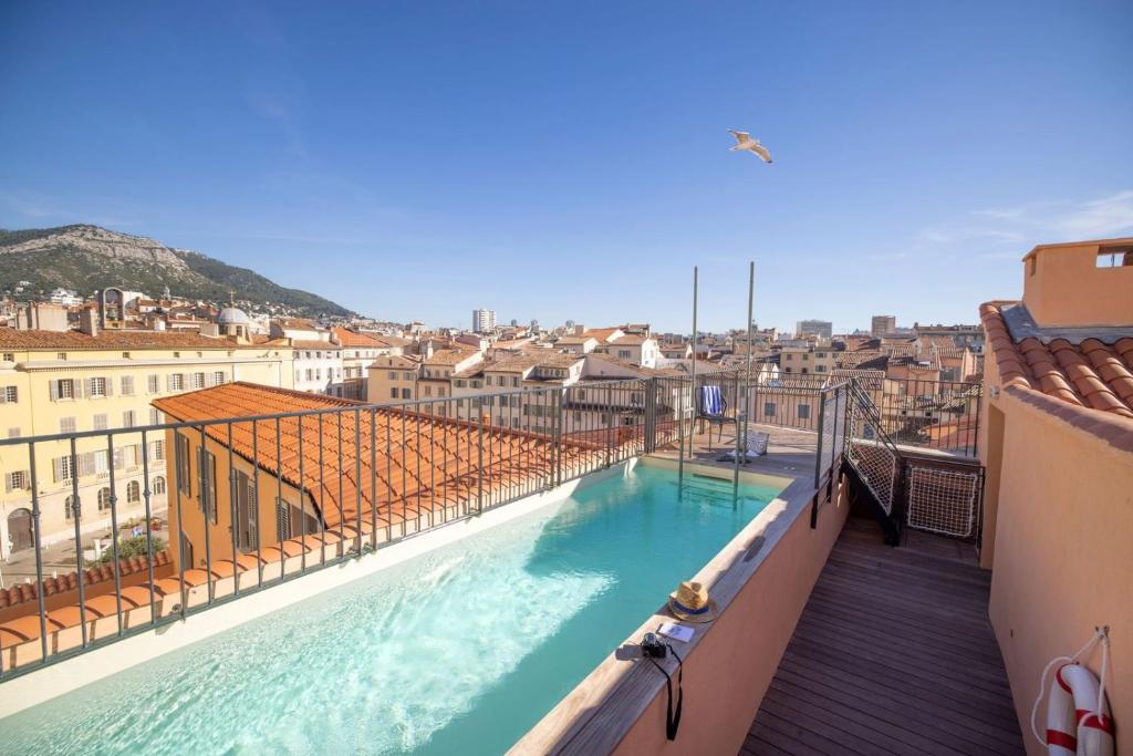 a view of a swimming pool from a building at L'Eautel Toulon Centre Port in Toulon