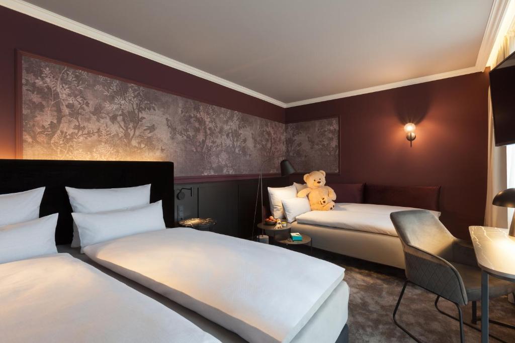 ERIKA Boutiquehotel Kitzbühelにあるベッド