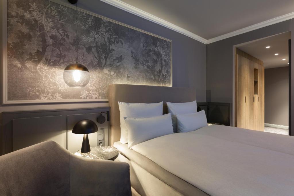 ERIKA Boutiquehotel Kitzbühelにあるベッド