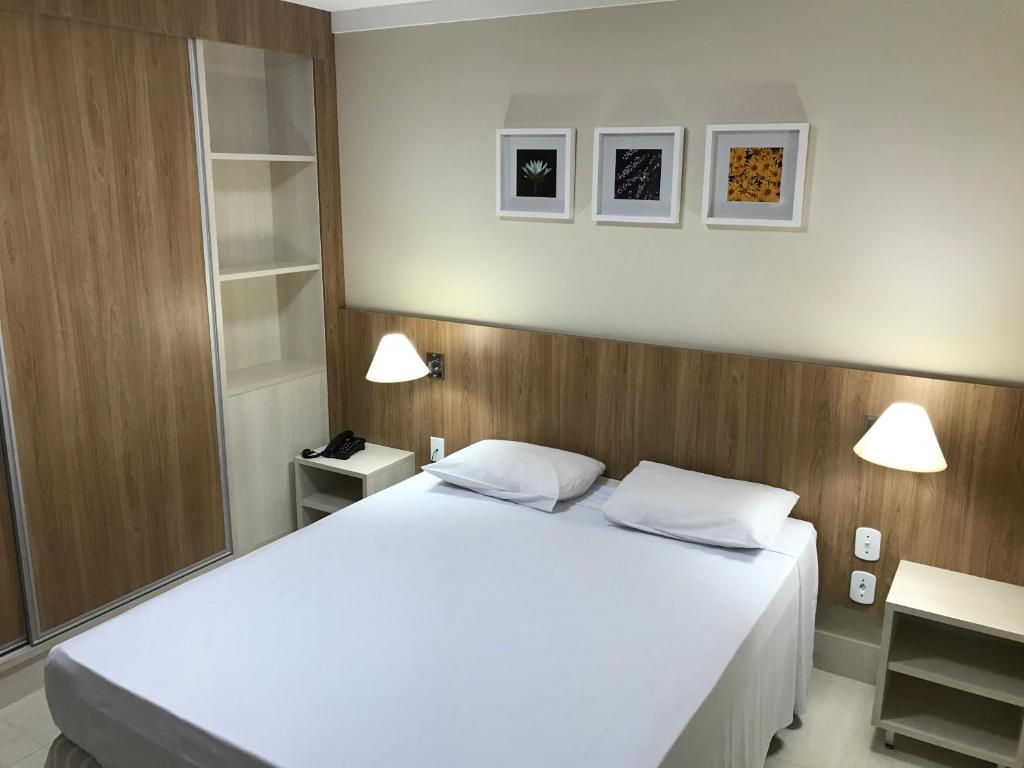 Ένα ή περισσότερα κρεβάτια σε δωμάτιο στο Piazza Diroma com acesso Acqua Park e Splash