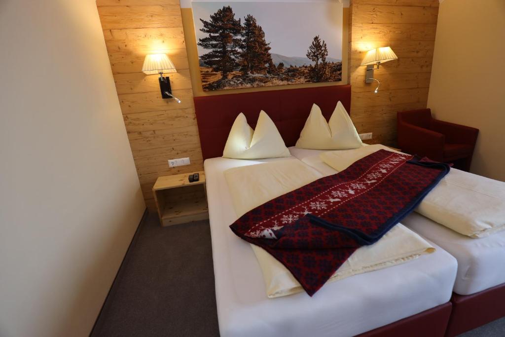 Postel nebo postele na pokoji v ubytování Pension & Appartements Ronacherhof