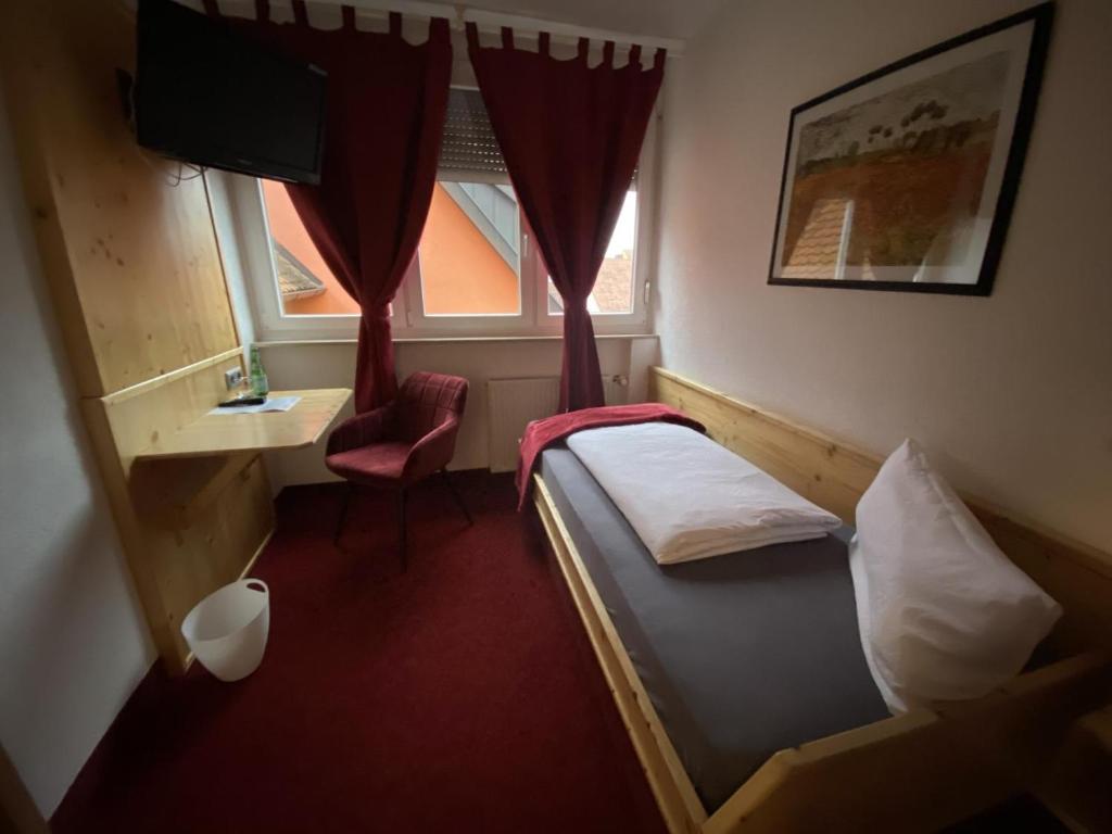 Postel nebo postele na pokoji v ubytování Hotel Wilder Mann