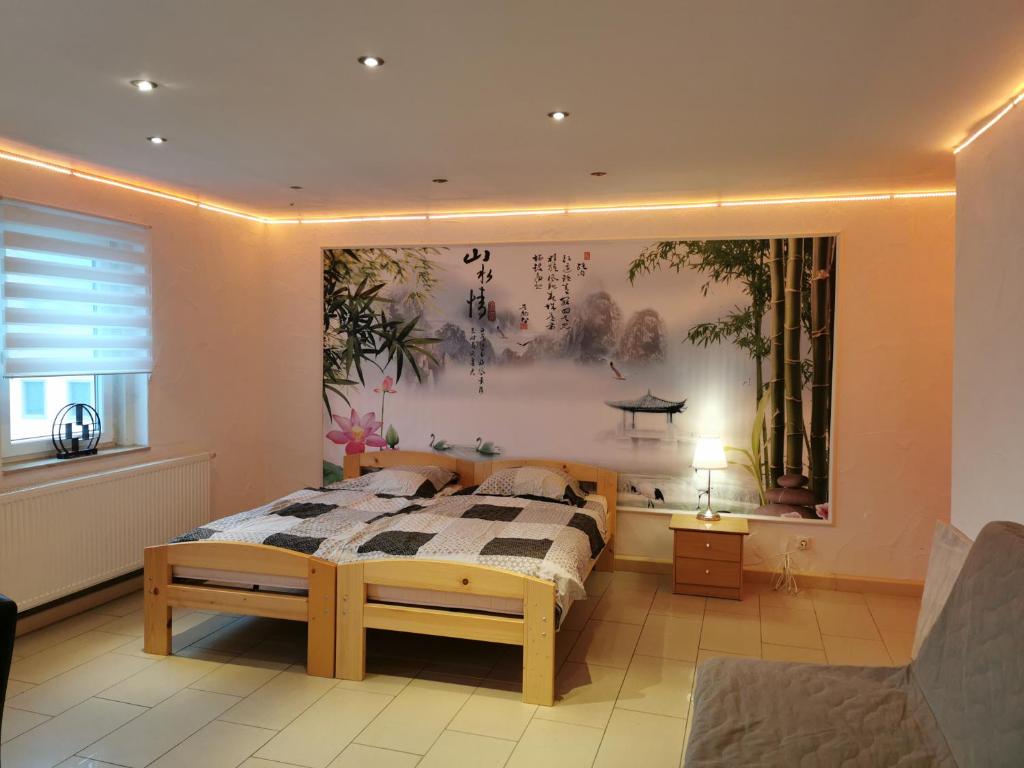 Кровать или кровати в номере Pension Xiang-Ming