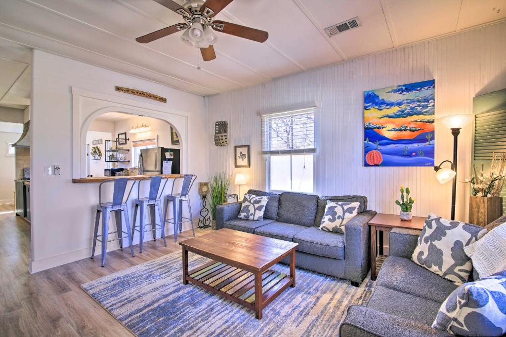 a living room with a couch and a table at Texas Home with Backyard Oasis, Walk to Main St in Fredericksburg