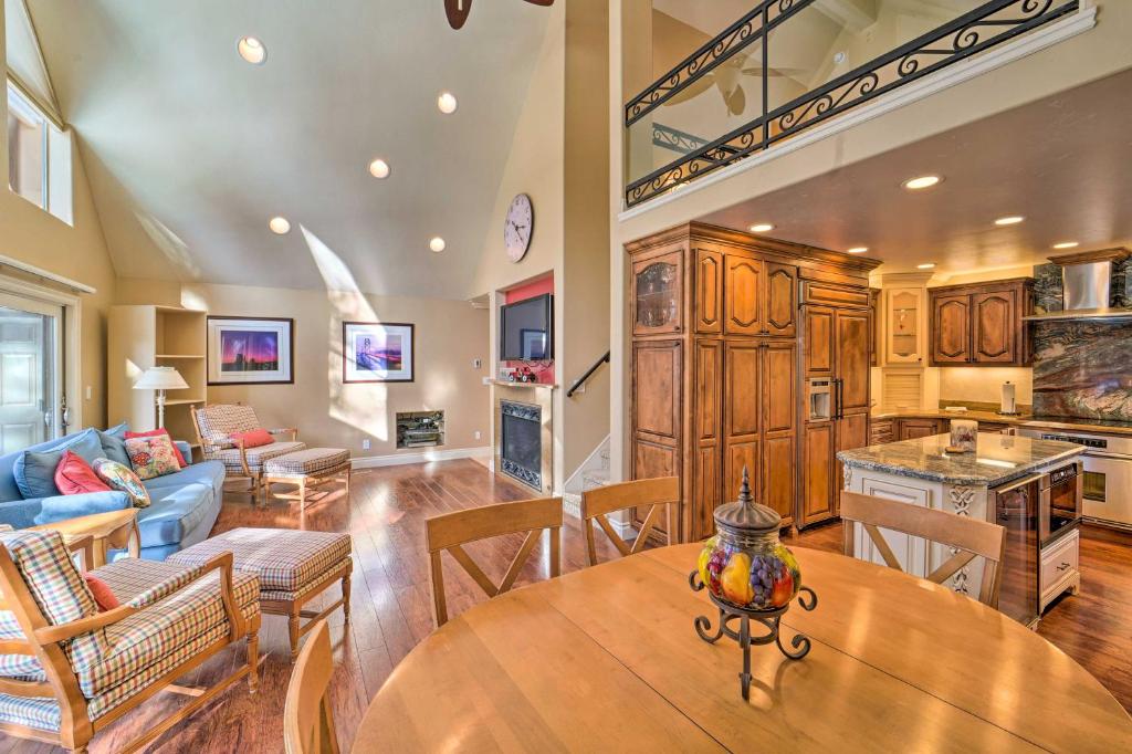 a kitchen and living room with a wooden table at 4 Mi to Dtwn Truckee Tahoe Donner Home with Hot Tub in Truckee