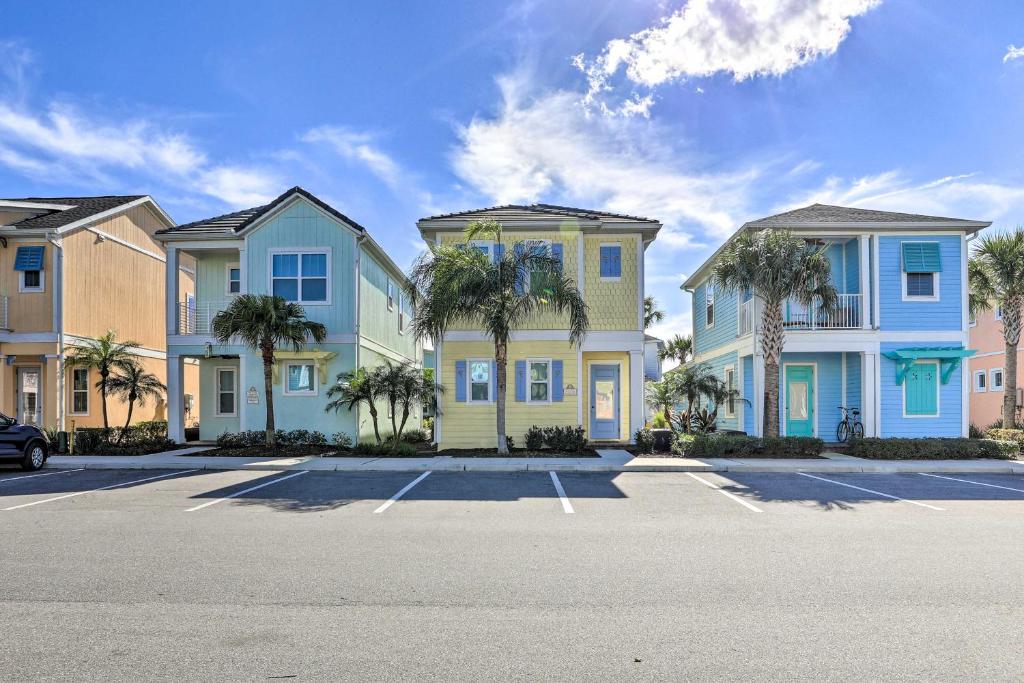 a row of houses with palm trees in a parking lot at Contemporary Home with Hot Tub 4 Mi to Disney Magic in Orlando