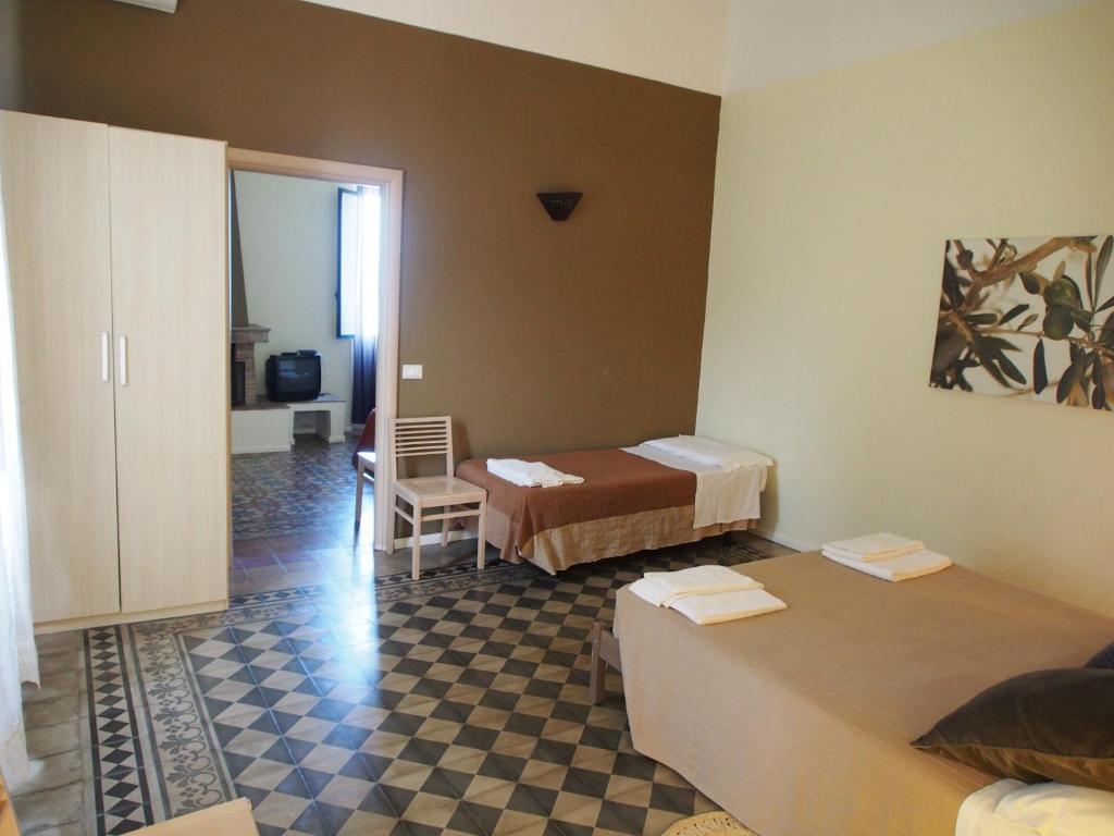 Posteľ alebo postele v izbe v ubytovaní Casavacanze Residence Maia Volcani