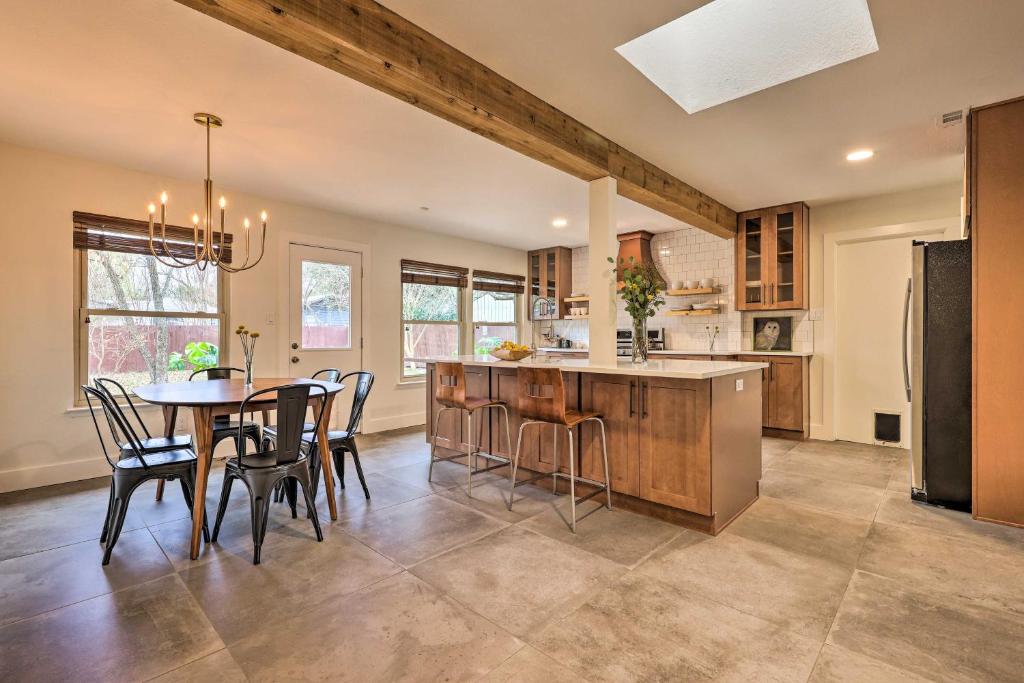 an open kitchen with a table and chairs in a kitchen at 6 Mi to Dtwn Austin Home with Screened Porch and Yard in Austin