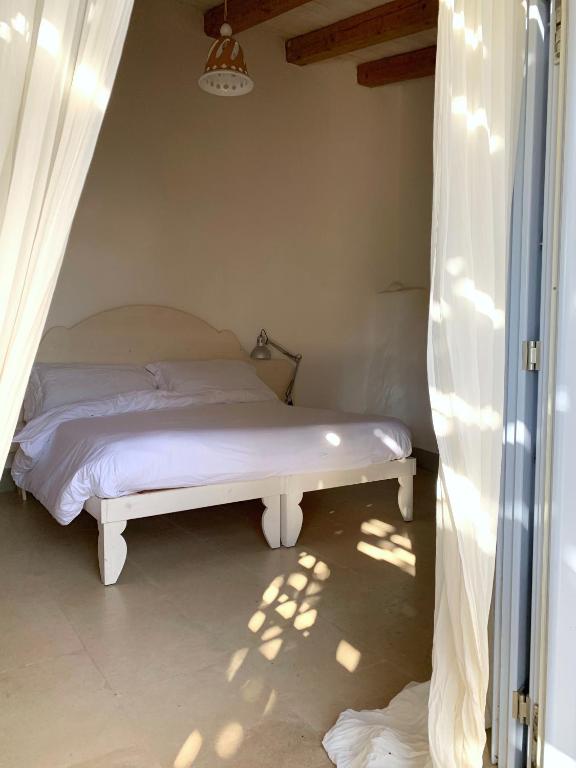 Postel nebo postele na pokoji v ubytování Masseria Caposella