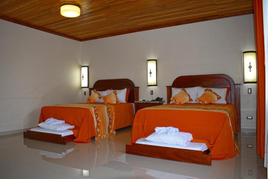 Postel nebo postele na pokoji v ubytování Los Lagos Spa & Thermal Resort Experience