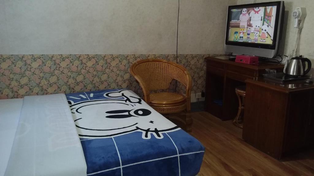 TV a/nebo společenská místnost v ubytování Uni Hotel
