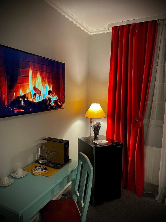 TV a/nebo společenská místnost v ubytování Vila De Argint Aleea Pelesului Nr 2