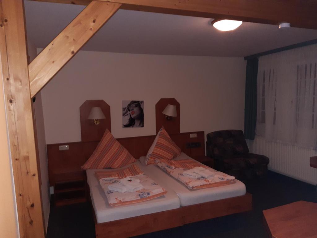Postel nebo postele na pokoji v ubytování Desperados Hotel