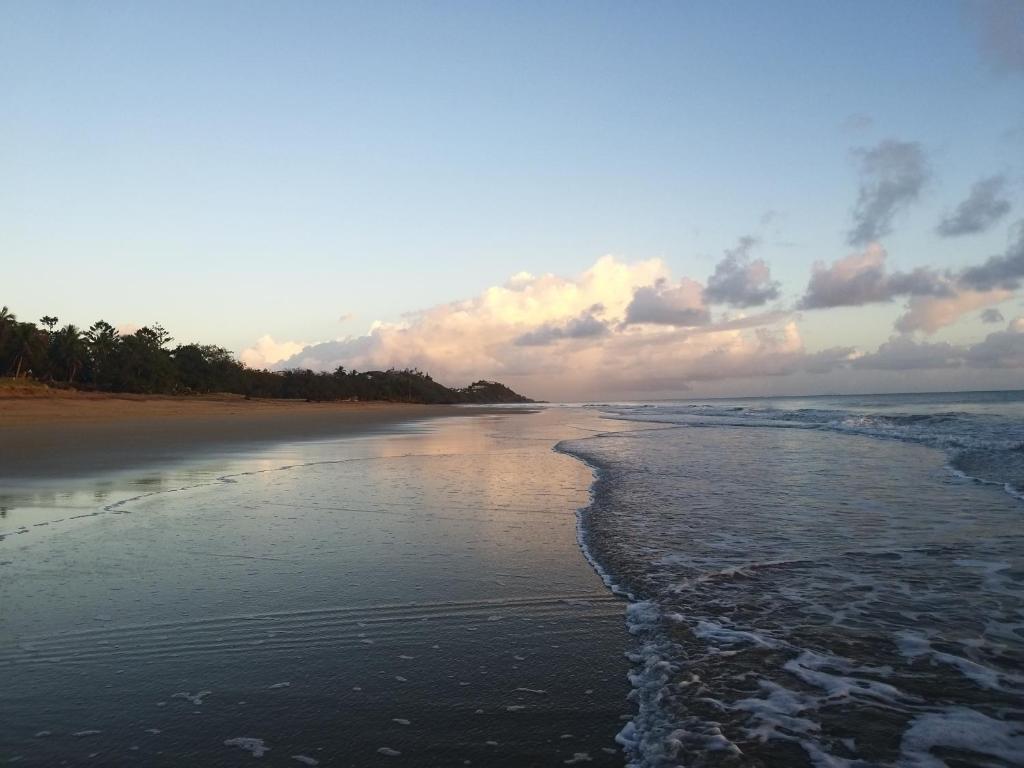 a view of the beach at sunset at The Shores Holiday Apartments in Mackay