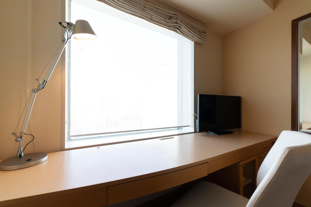 TV a/nebo společenská místnost v ubytování Hotel Associa Toyohashi