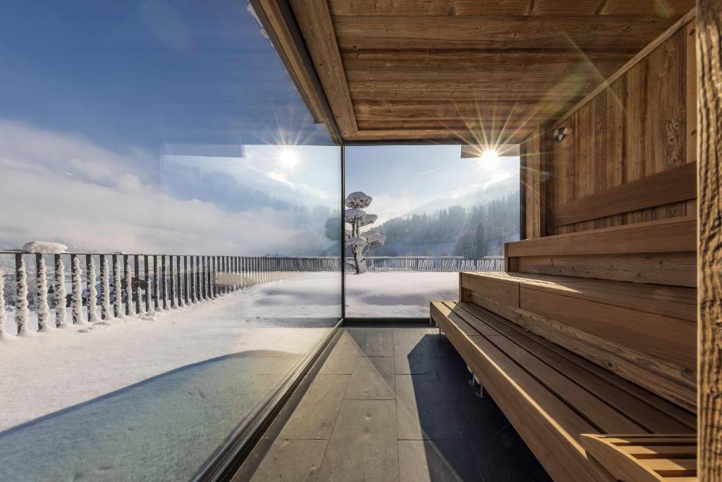 a glass walled plunge pool in a house with a view at Chalet Isabella in Kaltenbach