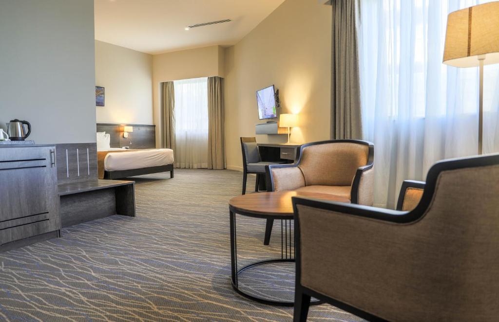 Postel nebo postele na pokoji v ubytování Eka Hotel Eldoret