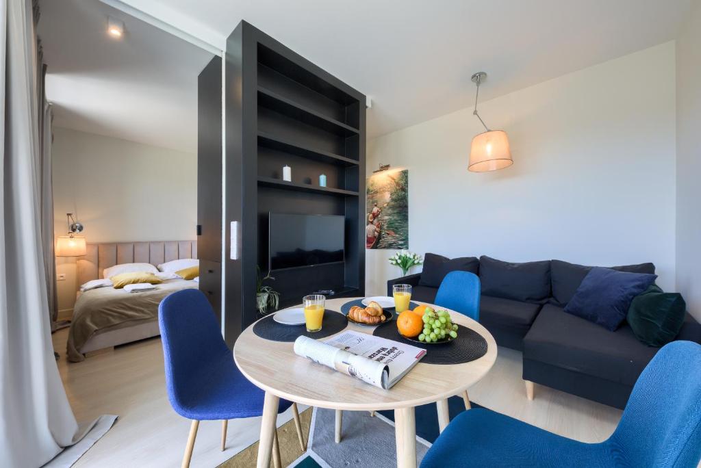 Posteľ alebo postele v izbe v ubytovaní KaZou Residence