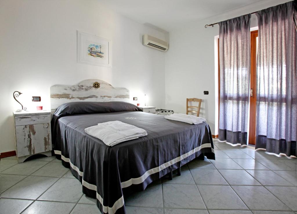 Postel nebo postele na pokoji v ubytování Luxury Room Vittorio Emanuele II