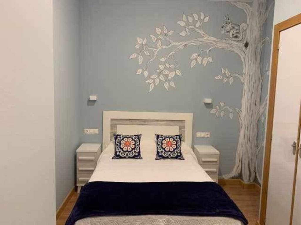 Postel nebo postele na pokoji v ubytování Cumbres de los Picos Apartamento Urriellu