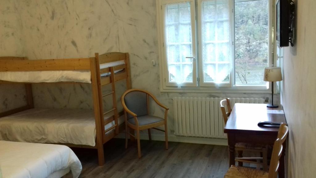 Postel nebo postele na pokoji v ubytování La Cremaillere