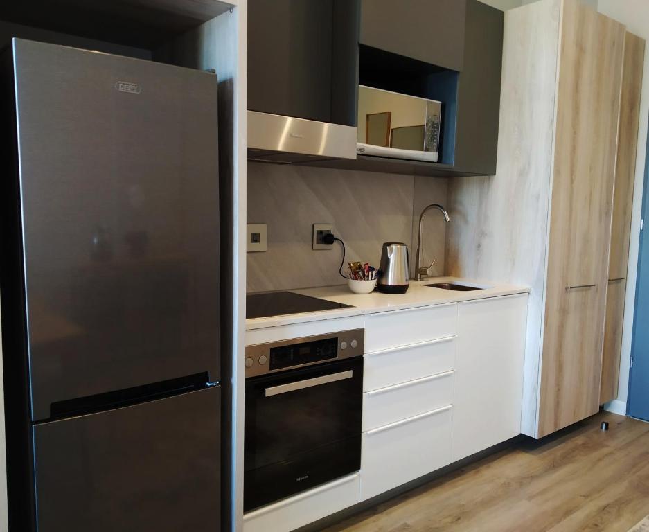 Kuchyň nebo kuchyňský kout v ubytování Menlyn Apartment