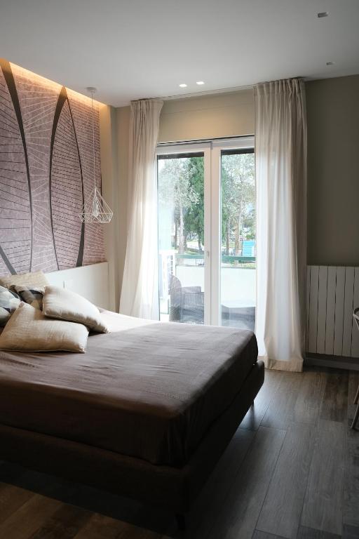 Voodi või voodid majutusasutuse Garibaldi House - B&B Luxury toas