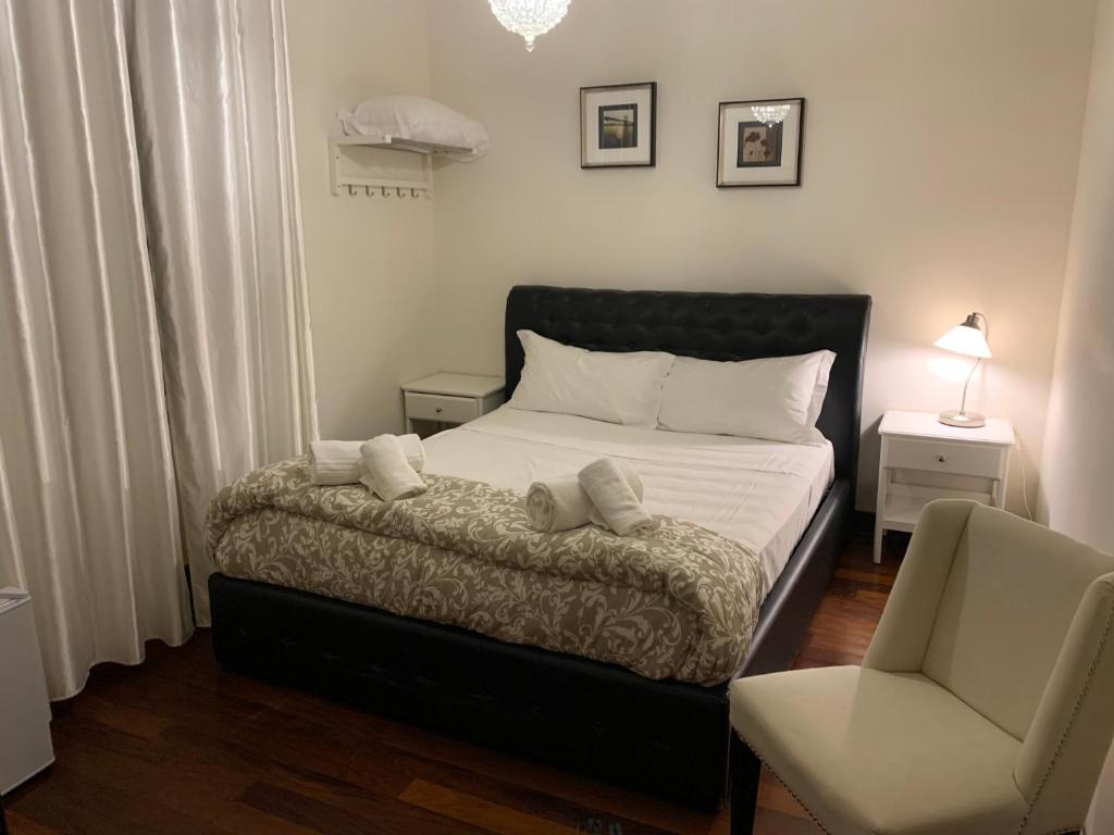 Ένα ή περισσότερα κρεβάτια σε δωμάτιο στο VILLA MASI Rental Rooms