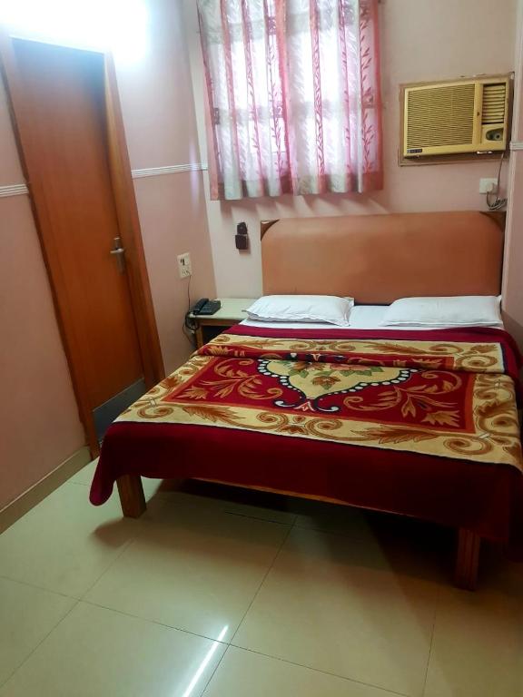Postel nebo postele na pokoji v ubytování Hotel Queen