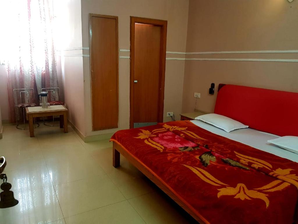 Postel nebo postele na pokoji v ubytování Hotel Queen
