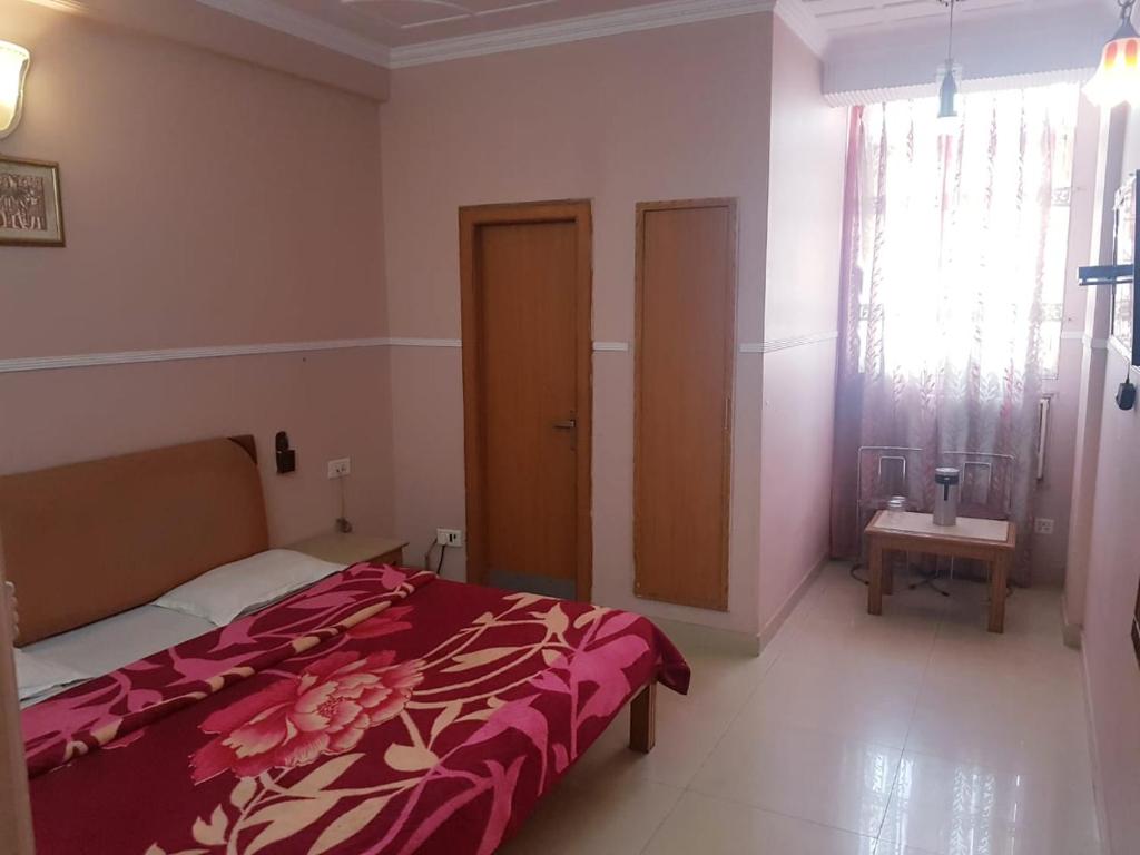 Postel nebo postele na pokoji v ubytování Hotel Queen