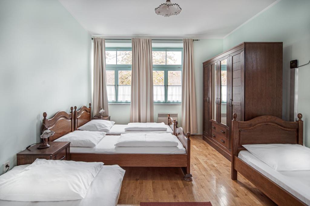 Postel nebo postele na pokoji v ubytování Parma Guesthouse & Apartments