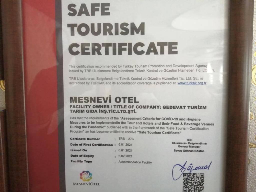 a sign for a cafe tourism certificate at Mesnevi Hotel in Konya