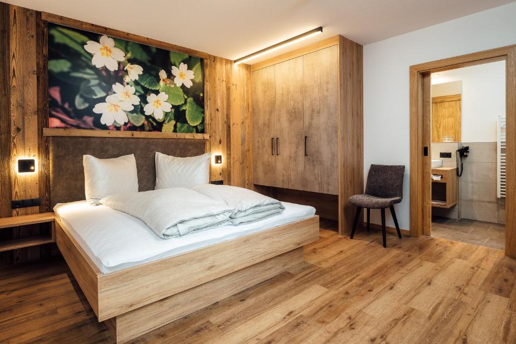 Postel nebo postele na pokoji v ubytování Alpenheimat Laurschhof