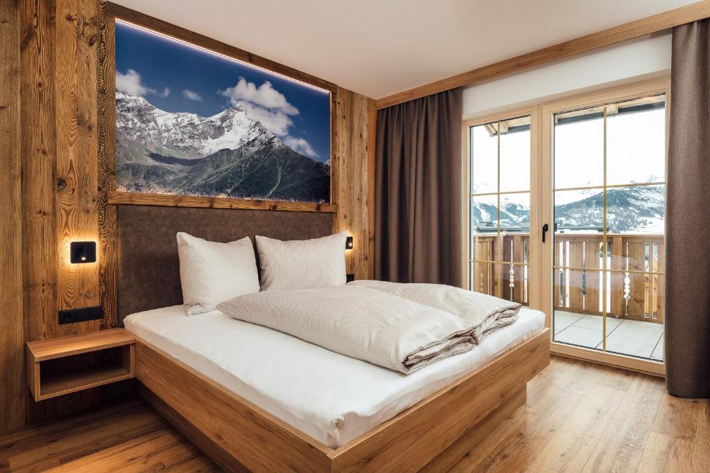 Postel nebo postele na pokoji v ubytování Alpenheimat Laurschhof