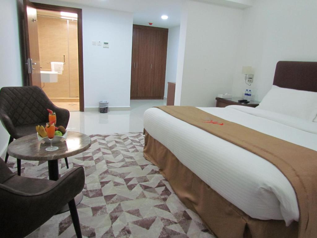 Postel nebo postele na pokoji v ubytování Mirage Hotel