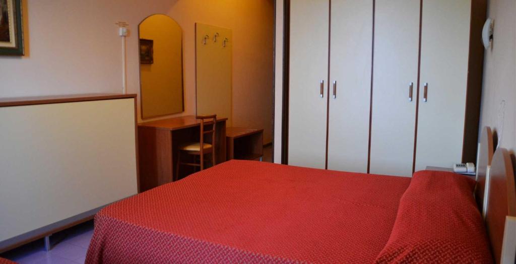 Postel nebo postele na pokoji v ubytování Hotel Europa Gran Sasso