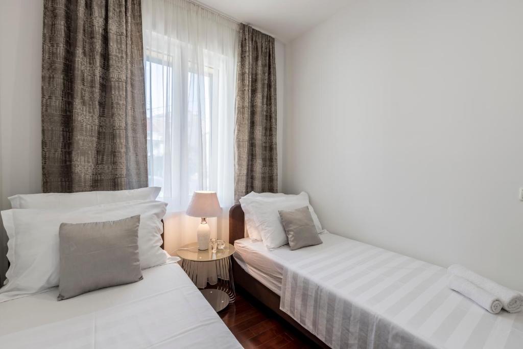 Posteľ alebo postele v izbe v ubytovaní Villa Meri very central and beautiful apartment