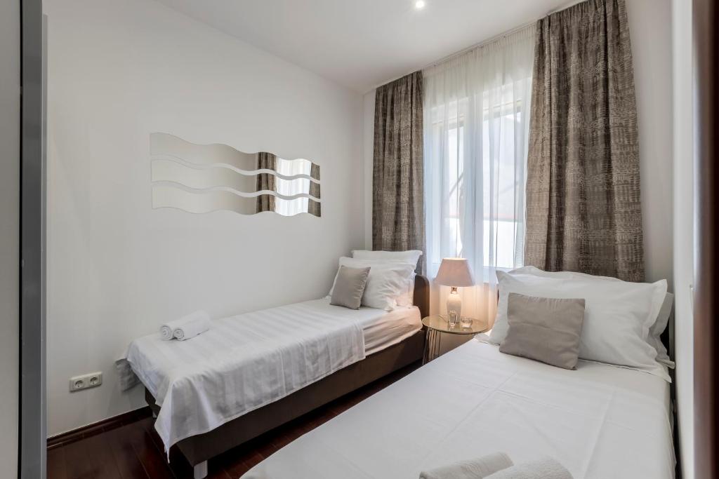 Posteľ alebo postele v izbe v ubytovaní Villa Meri very central and beautiful apartment