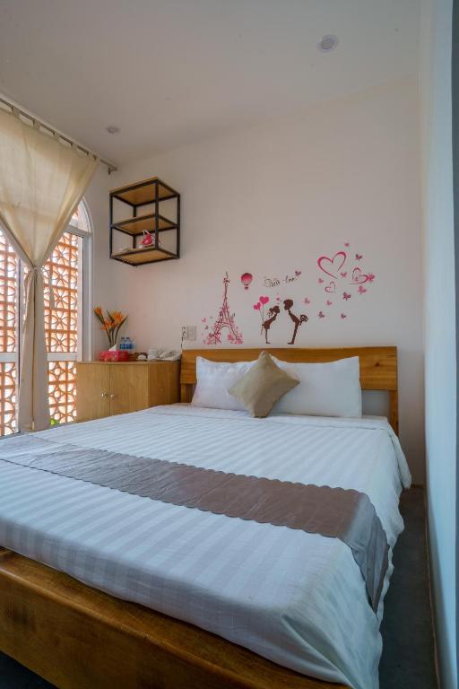 Postel nebo postele na pokoji v ubytování Mekong 69 Hostel