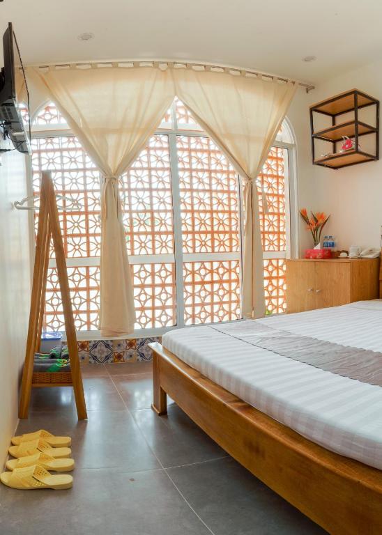 Postel nebo postele na pokoji v ubytování Mekong 69 Hostel