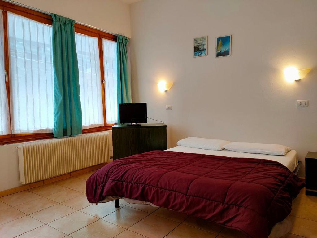 Postel nebo postele na pokoji v ubytování Residence Abete