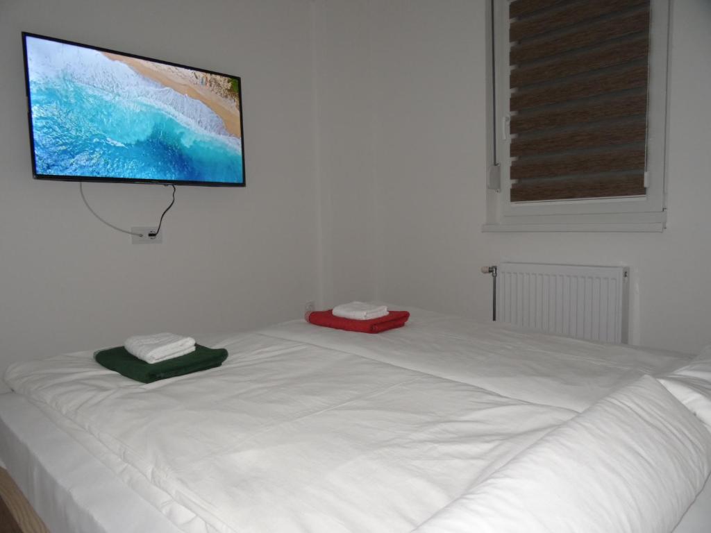Postel nebo postele na pokoji v ubytování Apartman N&N