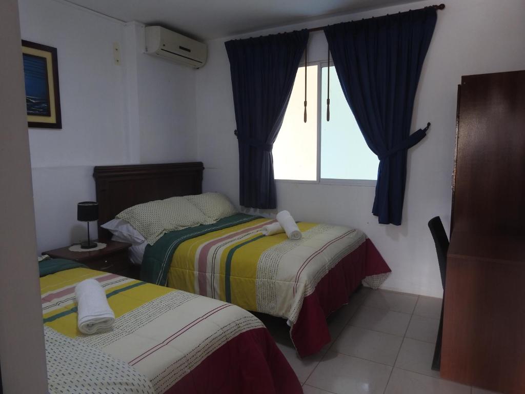 Postel nebo postele na pokoji v ubytování Hotel Valeritos