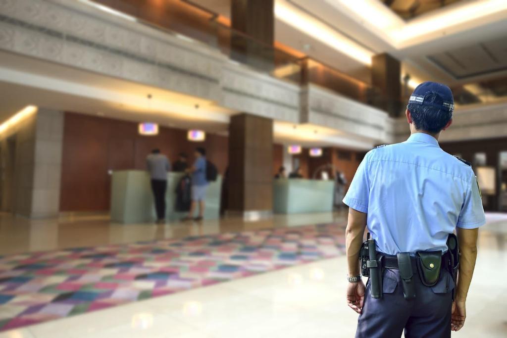 a police officer standing in a hallway in a building at Renu Suites at The Burlington Portland in Portland