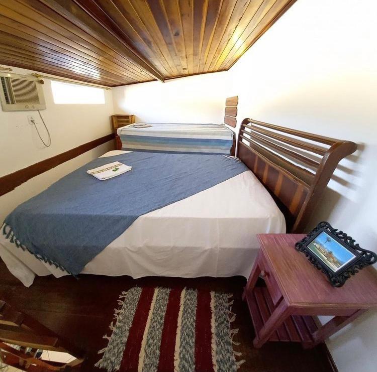Кровать или кровати в номере Flats Paraty
