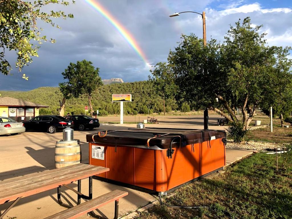 an orange dumpster with a rainbow in the sky at Tower 64 Motel & RV in Trinidad