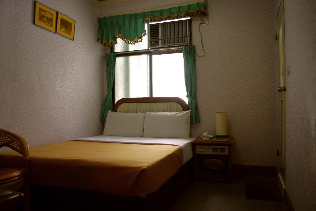 Postel nebo postele na pokoji v ubytování Uni Hotel