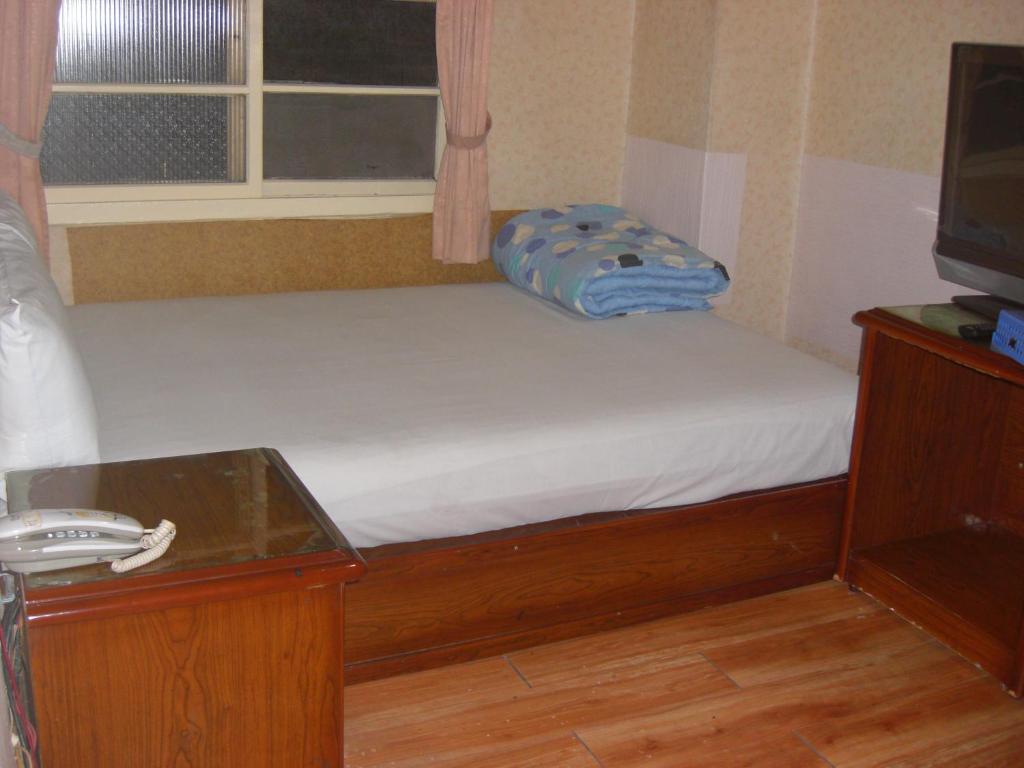 Postel nebo postele na pokoji v ubytování Uni Hotel