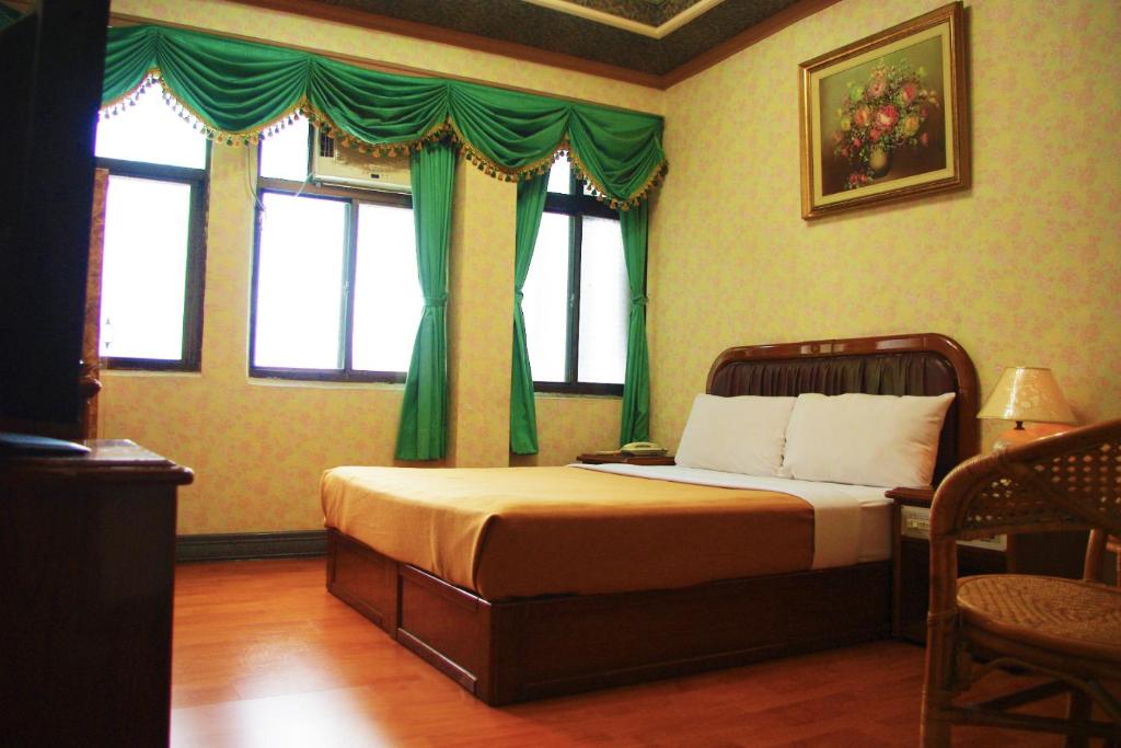 Postel nebo postele na pokoji v ubytování Uni Hotel